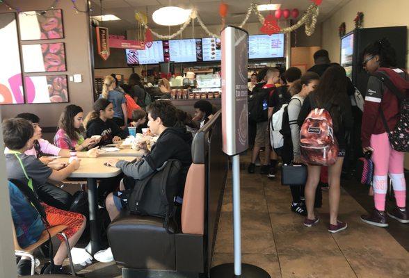 Located in a small shopping center beside Coral Springs Middle School. Packed with students at 8:45am.