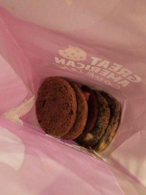 6 cookies: hot cocoa red velvet, peanut butter supreme, snickerdoodle, oatmeal raisin, blueberry muffin, and cookies and cream flavor.