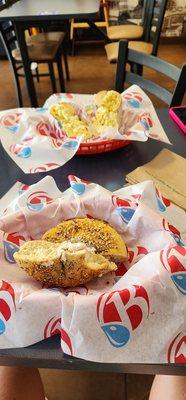 Egg salad everything bagel, and everything bagel with veggie cream cheese