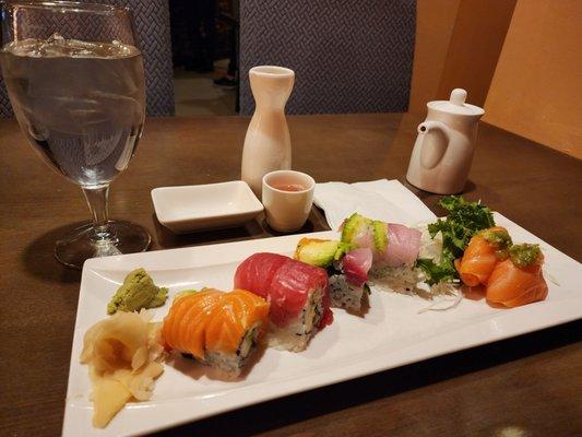 Hot sake, rainbow roll and sashimi fat salmon