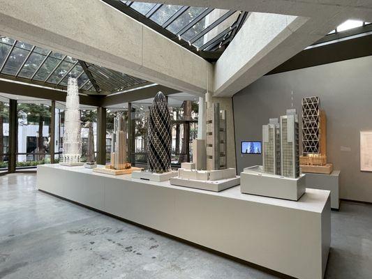 Models of tall buildings designed by famed architect Lord Norman Foster and his firm Foster + Partners