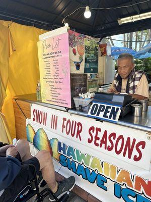 Nice man making the shave ice.