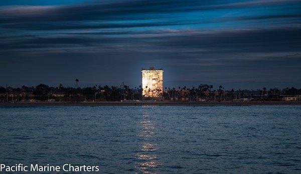 The sun reflecting off the Marina Towers, Oceanside.