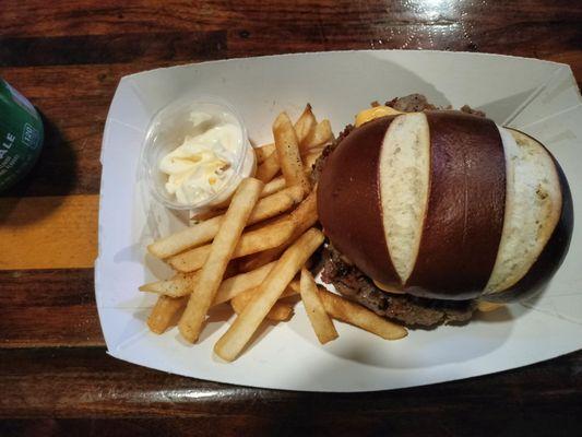 1/4 lb bacon-swiss burger on a pretzel roll, served with great fries: $10.99. Excellent!