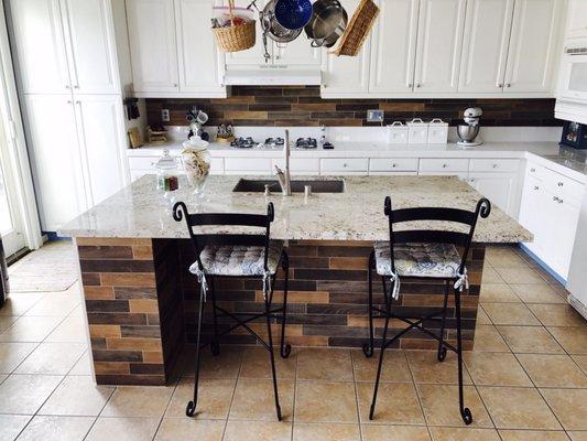 Natural Stone Granite Countertops and Italian Porcelain Wood-look Tile, supplied and installed by Surfaces in Castaic. Ask for George