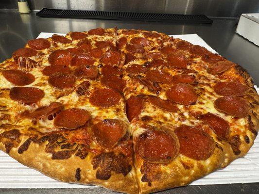 A beautiful large pepperoni pizza