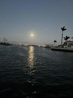 Moon over the water...tiki boat view