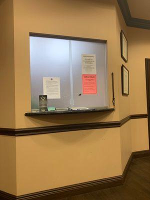 I really have to go to the bathroom and that window has not opened in 15 minutes ? It says do not knock or tap on window.