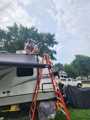 Helping me remove our broken awning. He didn't charge me for this.
