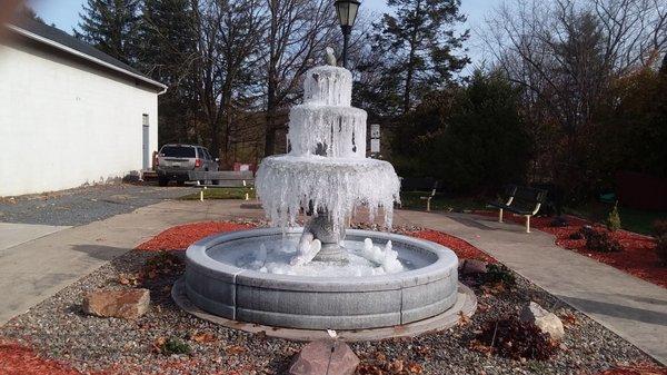In winter, the fountain is a pretty sight welcoming visitors.