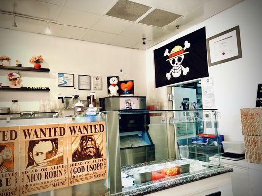 One Piece wanted posters and flags and BT21's RJ and Tata plush decorates the whole store