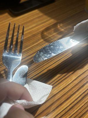 it was mainly water stains on the silverware but there was crusty old food on the fork.