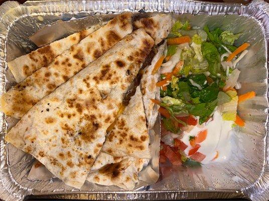 Carne Quesadilla it was cold no melt in queso cheese. The salad tasted better than the quesadilla