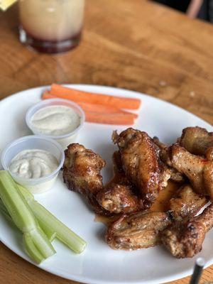 Cocktails drinks and wings with thai sweet chili sauce.