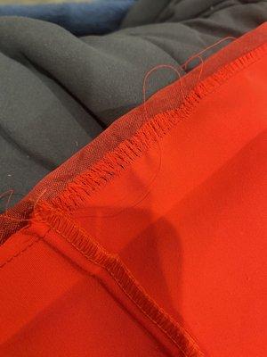 Alternations were rushed and done poorly, caused the entire actual dress line and material to start to unravel.