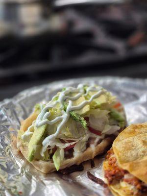 HUARACHES tortilla with beans, meat of your choice, melted  cheese, sour cream, tamotoes, avocado lettuce