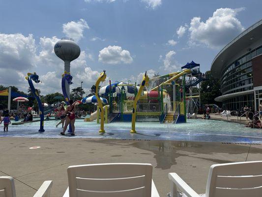 The kiddie area, behind that 2 slides, lazy river and regular pool.