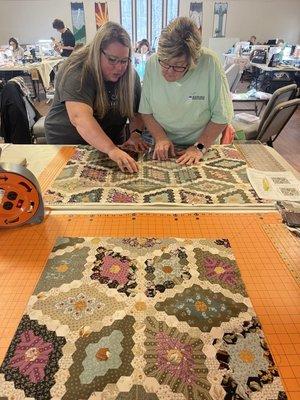 Amy and Cheryl working hard to make a beautiful quilt.