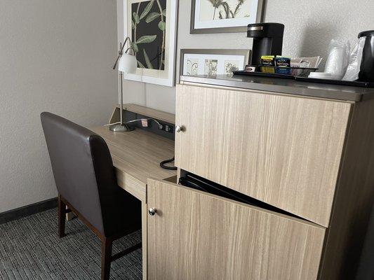 Desk area. The refrigerator cabinet door won't close.