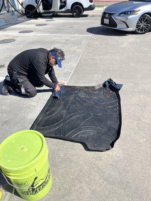 This is him wiping down the floor in the back cleaning off my daughter Softball dirt