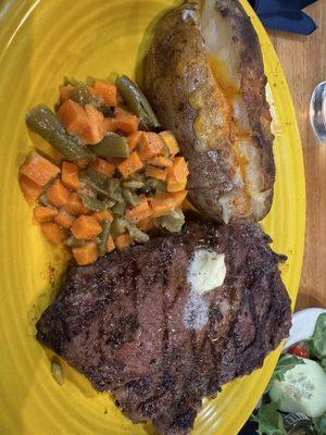 Ribeye with baked potato and veggies