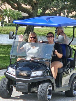 My Wife in the back letting her cousin drive. They are enjoying our fantastic cart. Thanks Sean we are making memories