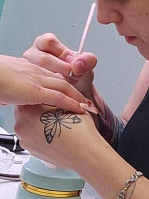 Owner working on her clients nail art.