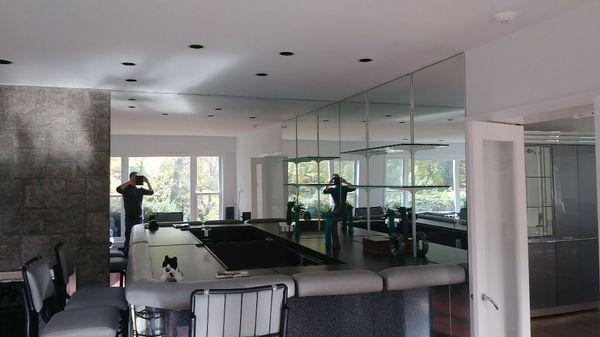 Mirrored wall surrounding bar are.