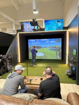 Three friends enjoying a round in bay 4.