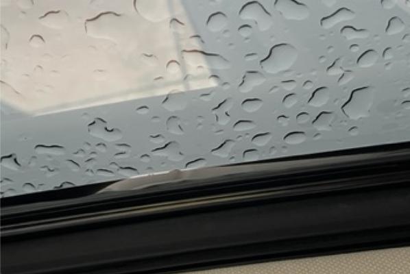 Vizion AutoSports - Bubbles in the roof tint, gaps in the edges, and loose tint hanging down.