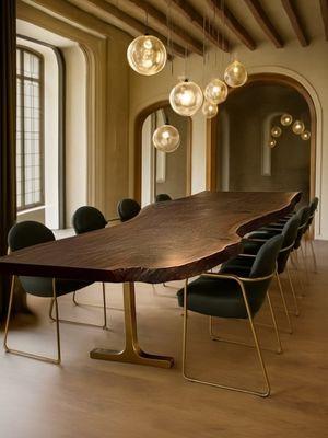 This beautiful live-edge Claro Walnut slab, set on cast bronze T-legs, celebrates the harmony between organic form and refined design.