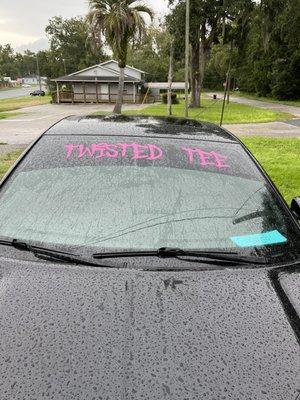 Got twisted tee on the windshield in pink my windows are 5% tint with my strip lower then it goes