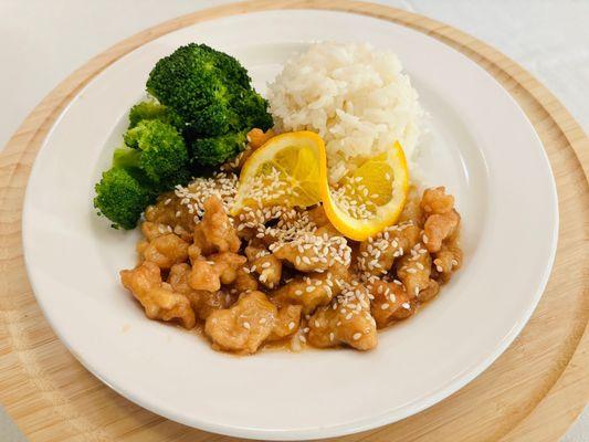 Fresh orange chicken with steamed broccoli and rice. Quality senior dining at Sunny Rose Senior Living.