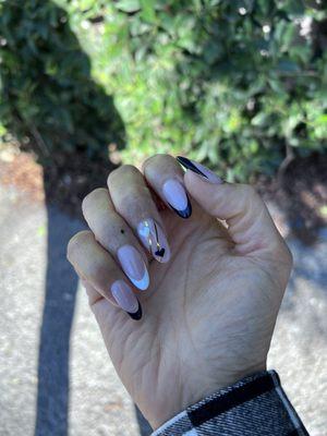 Gel X medium length, French tip, heart design with gold stencils : by Rosie