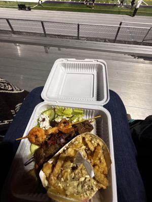 Brochetas, salad and Greek fries