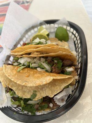 Al pastor, lengua, and carne asada tacos