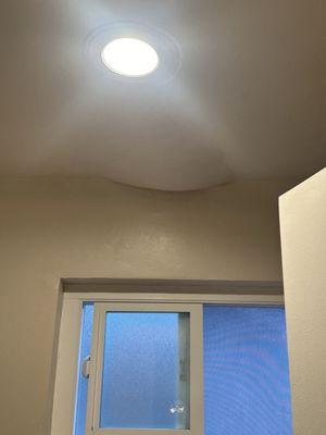 This is the ceiling bulging with water from the room above us. This grew 3x overnight.