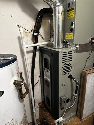 The PVC pipe is new. They taught me about preventing buildup by pouring a bit of bleach in there. Oh and that's my new furnace.
