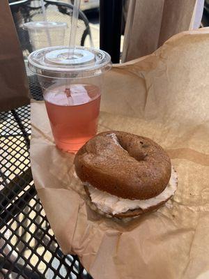 Cinnamon raisin bagel with cream cheese, strawberry refresher