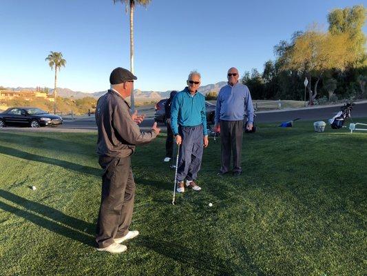 Doctor Larry works with a short game clinic