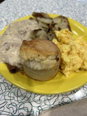 Country fried steak, potatoes, fresh biscuits, scrambled eggs
