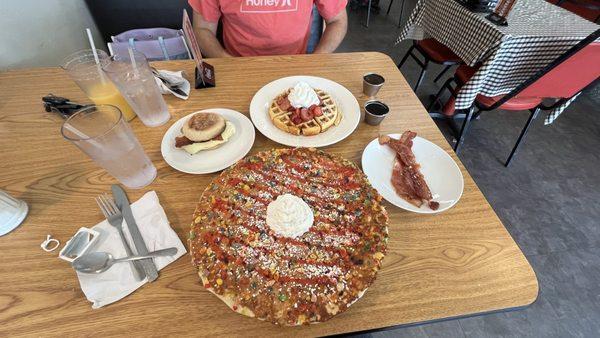 Fruity Pebble Pancake, Strawberry Belgian Waffle and a Bacon Egg and Cheese with a side of extra bacon.