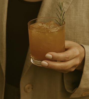 Our Grounded Whiskey Smash with a smoked rosemary finish to garnish.