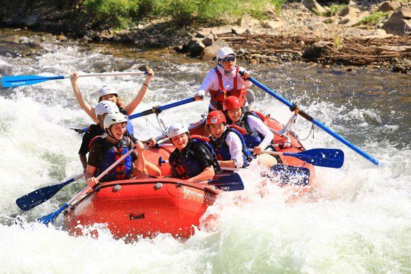 Kids having the time of their lives whitewater rafting