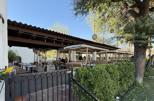 Outdoor bar & patio with swing dining tables.