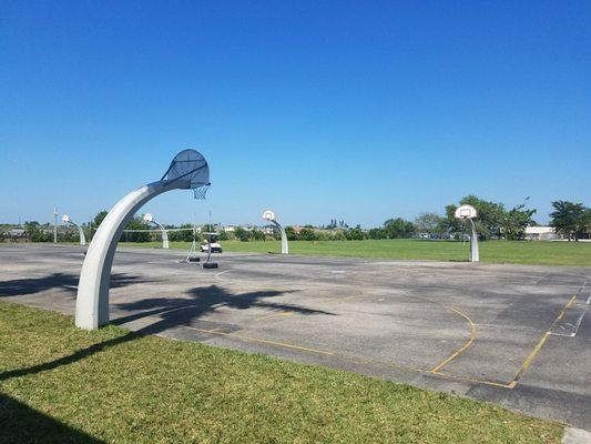 Basketball court, fields in back