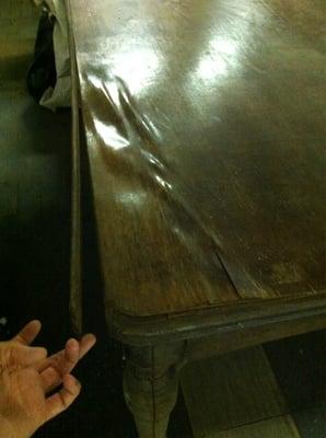 A 1922 table destroyed by this facility's leaking roof! No offer, not even an apology!