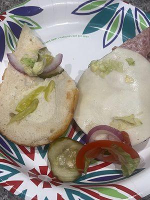 One singular pepperoncini and hardly any lettuce.