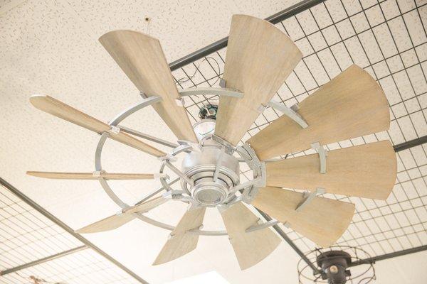 Windmill fan in galvanized metal finish with weathered wood blades