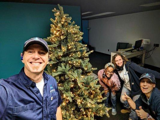 Team with Christmas tree